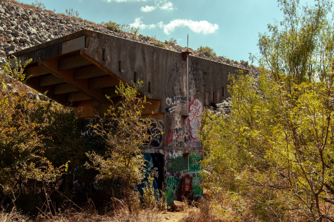 An old spray painted dam gate.